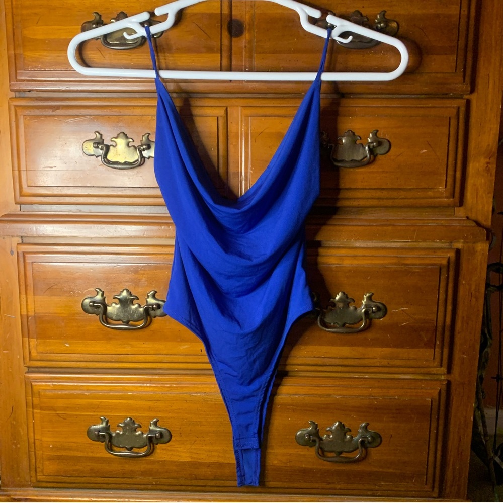 Royal blue Body suit. Never worn, still has tag.